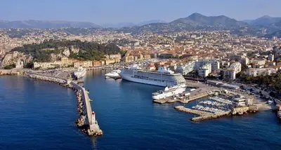 a large cruise ship docked in a harbor at Seaside Studio by iCasamia it in Nice
