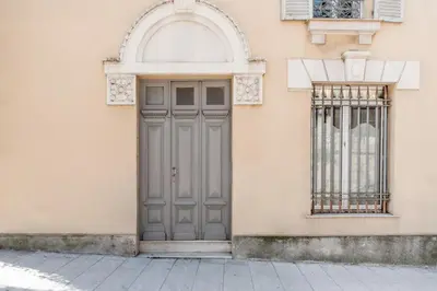a door on the side of a building with a window at Seaside Studio by iCasamia it in Nice