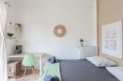 a bedroom with a bed with a hammock on it at 26 nice , La Riviera in Nice