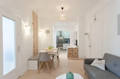 a living room with a couch and a table at 26 nice , La Riviera in Nice