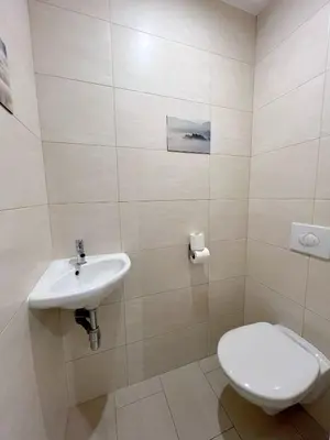 a bathroom with a toilet and a sink at Petit 2 pièces Carré d'Or in Nice