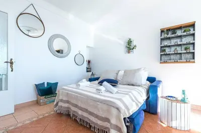 a bedroom with a bed and a mirror at MY CASA - FRANCK PILATTE - Beautiful Sea View - Near the Port in Nice