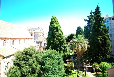 a group of trees in front of a building at Congrès Carré d'Or by Booking Guys in Nice