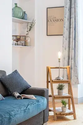 a living room with a couch and a wooden chair at MY CASA - GALLIENI - Superb & Unique in City Center in Nice