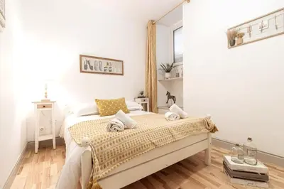 a bedroom with a bed in a white room at MY CASA - GALLIENI - Superb & Unique in City Center in Nice
