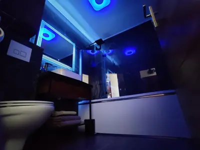 a bathroom with a toilet and blue lights at Legion Suite - Your perfect vacation ! in Nice