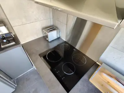 an overhead view of a stove top in a kitchen at Legion Suite - Your perfect vacation ! in Nice