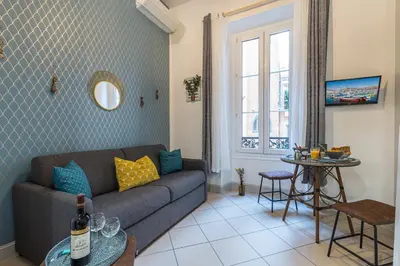 a living room with a couch and a table at MY CASA - SAINT SIAGRE 1 in Nice