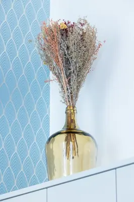 a vase with flowers in it sitting on a shelf at MY CASA - SAINT SIAGRE 1 in Nice