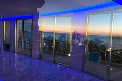 a view of the ocean from the balcony of a building at Promenade des anglais Amazing sea view 140M2 3BR in Nice