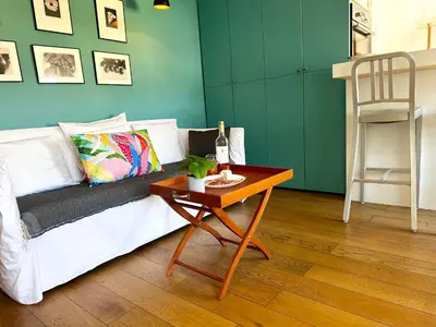 a living room with a white couch and a table at Homelivia, Lovely One bedroom flat Place GARIBALDI et PORT in Nice