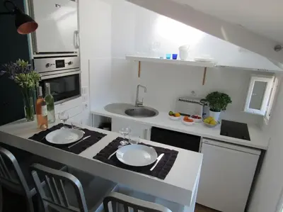 a kitchen with two white plates on a counter at Homelivia, Lovely One bedroom flat Place GARIBALDI et PORT in Nice
