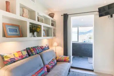 a living room with a couch and a window at La Terrasse du Port AP4212 in Nice