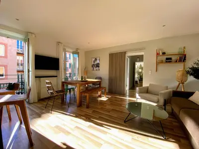 a living room with a couch and a table at Sunny and calm 2 bed apartment place du Pin in Nice