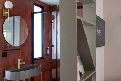 a bathroom with a sink and a mirror at Ikonik Jean Médecin in Nice