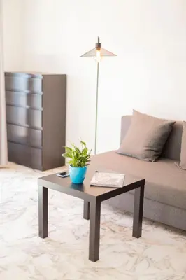 a living room with a coffee table and a couch at Studio with terrace and sea view, 10 min to the beach in Nice