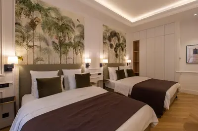 a hotel room with two beds in a room at QUAI PROMENADE New Seafront Balcony Air Conditioning in Nice