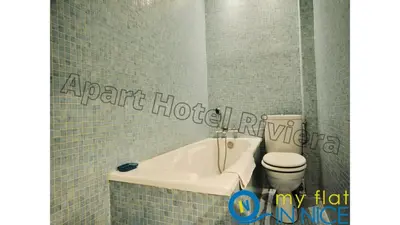 a bathroom with a sink and a toilet and a tub at ApartHotel Riviera - Hyper Centre Ville - Studio Supérieur AC avec balcon et aperçu mer - BALCON MASSENET 1 in Nice