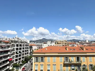 a view of a city with buildings and cars at ApartHotel Riviera - Hyper Centre Musiciens - Superior 1 Bedroom Apartement AC - Balcony - 10 mn Promenade des Anglais - BALCON PALAIS EXCELSIOR 1 in Nice