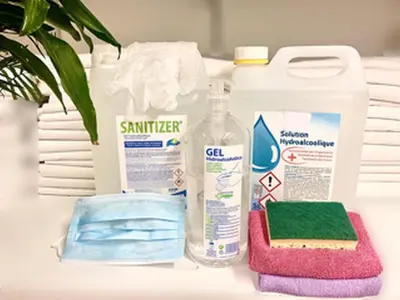 a counter with cleaning products and a bottle of cleaner at ApartHotel Riviera - 2 minutes de la plage - Exceptionnel 2 chambres AC - BALCON MEYERBEER 1 in Nice