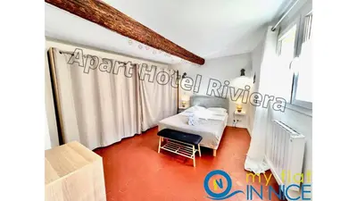 a bedroom with a bed and a chair in a room at ApartHotel Riviera - ISTRIA 1- Old town Promenade des Anglais - Superbe Appartement Superior 2 Pièces AC in Nice