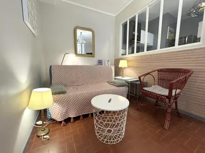 a small room with a table and a chair at ApartHotel Riviera - VINCENT 1 - Vieille Ville - Appartement Supérieur 2 pieces AC in Nice