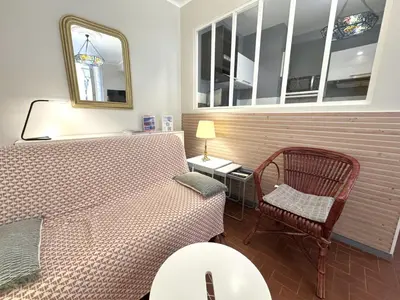 a room with a bed and a chair and a mirror at ApartHotel Riviera - VINCENT 1 - Vieille Ville - Appartement Supérieur 2 pieces AC in Nice