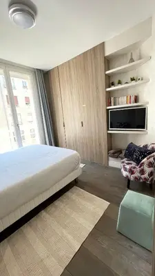a bedroom with a large bed and a window at Luxurious 2 Bedrooms Apartment, 30 meter from beach in Nice
