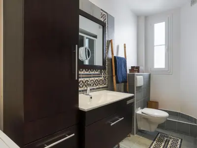 a bathroom with a sink and a toilet at Apartment Le Paganini by Interhome in Nice