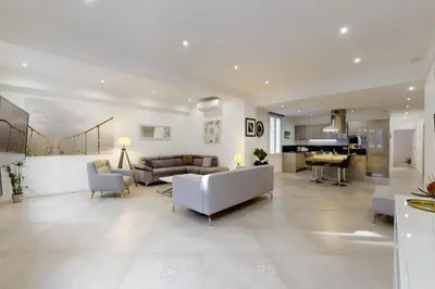 a living room with a couch and a table at Grand Suite Promenade Five stars holiday house in Nice
