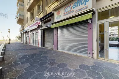 an empty street with two garage doors on a building at Grand Suite Promenade Five stars holiday house in Nice