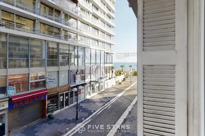 an empty street in front of a building at Grand Suite Promenade Five stars holiday house in Nice