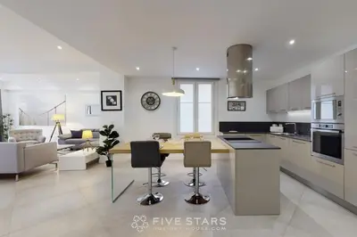 a kitchen and living room with a table and chairs at Grand Suite Promenade Five stars holiday house in Nice