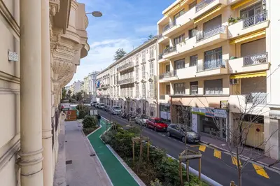 a city street with cars parked in front of buildings at FEEL HOME - Congrès 13 in Nice
