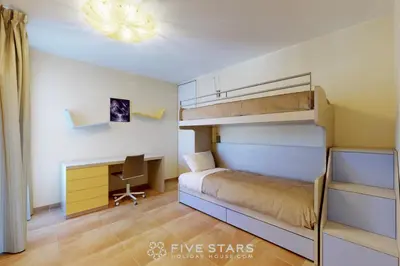 a bedroom with a bunk bed and a desk at LUXURY BEACH five STARS HOLIDAY HOUSE in Nice