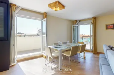 a dining room with a table and chairs at LUXURY BEACH five STARS HOLIDAY HOUSE in Nice