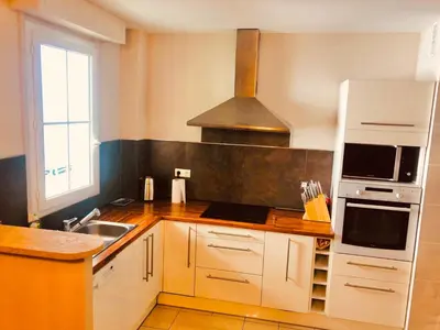 a kitchen with a sink and a stove top oven at City center cute flat with sea view one bedroom in Nice