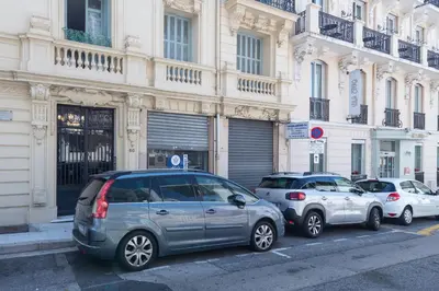 a row of cars parked in front of a building at 60 HEROLD - Magnifique Studio - Terrasse - Climatise in Nice