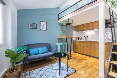 a living room with a couch and a kitchen at 1 GALLO LOT 2 - Studio Mezzanine en plein coeur du vieux Nice in Nice