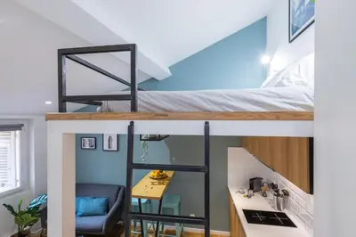 a room with a bunk bed and a desk at 1 GALLO LOT 2 - Studio Mezzanine en plein coeur du vieux Nice in Nice
