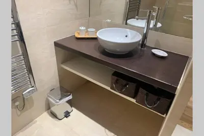 a bathroom with a bowl sink on a counter at 18 Garibaldi in Nice