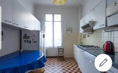a kitchen with a blue cover on the counters and a stove at Chambre chez particulier centre ville - Nice in Nice