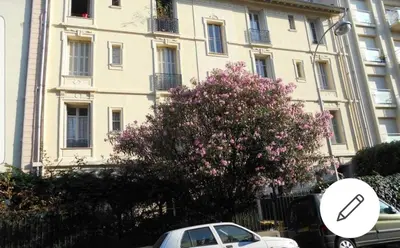 a white car parked in front of a building at Chambre chez particulier centre ville - Nice in Nice