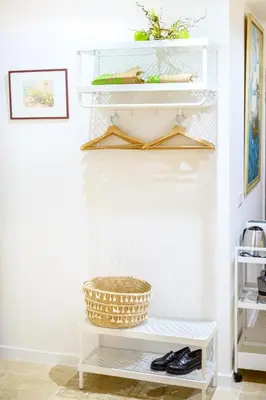 a room with white shelves and a basket on a shelf at Magnifique appartement au centre-ville de Nice in Nice