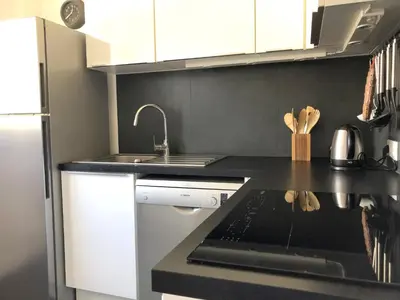 a kitchen with a sink and a counter top at Beautiful T3 terrasse Nice in Nice