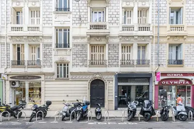 a row of motorcycles parked in front of a building at ChezDudi in Nice