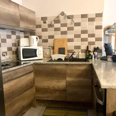 a kitchen with a sink and a microwave at CHARMING APARTMENT NEAR THE BEACH in Villefranche-sur-Mer