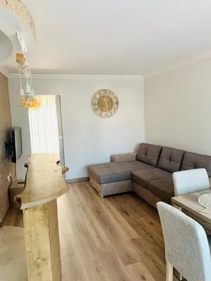 a living room with a couch and a table at Superbe 2 pièces à 50 m de la Promenade des Anglais in Nice