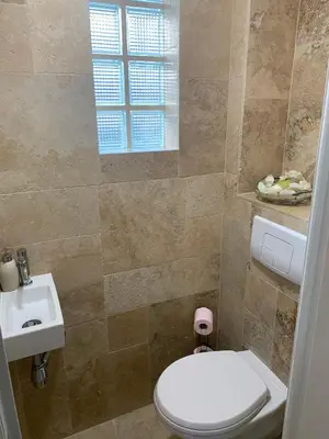 a bathroom with a toilet and a sink at Superbe 2 pièces à 50 m de la Promenade des Anglais in Nice