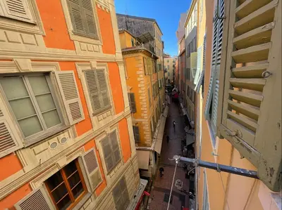 an alleyway between two buildings in a city at Nice Renting - JAURES - Cosy Flat - Nice old town - Great view - AirCon in Nice